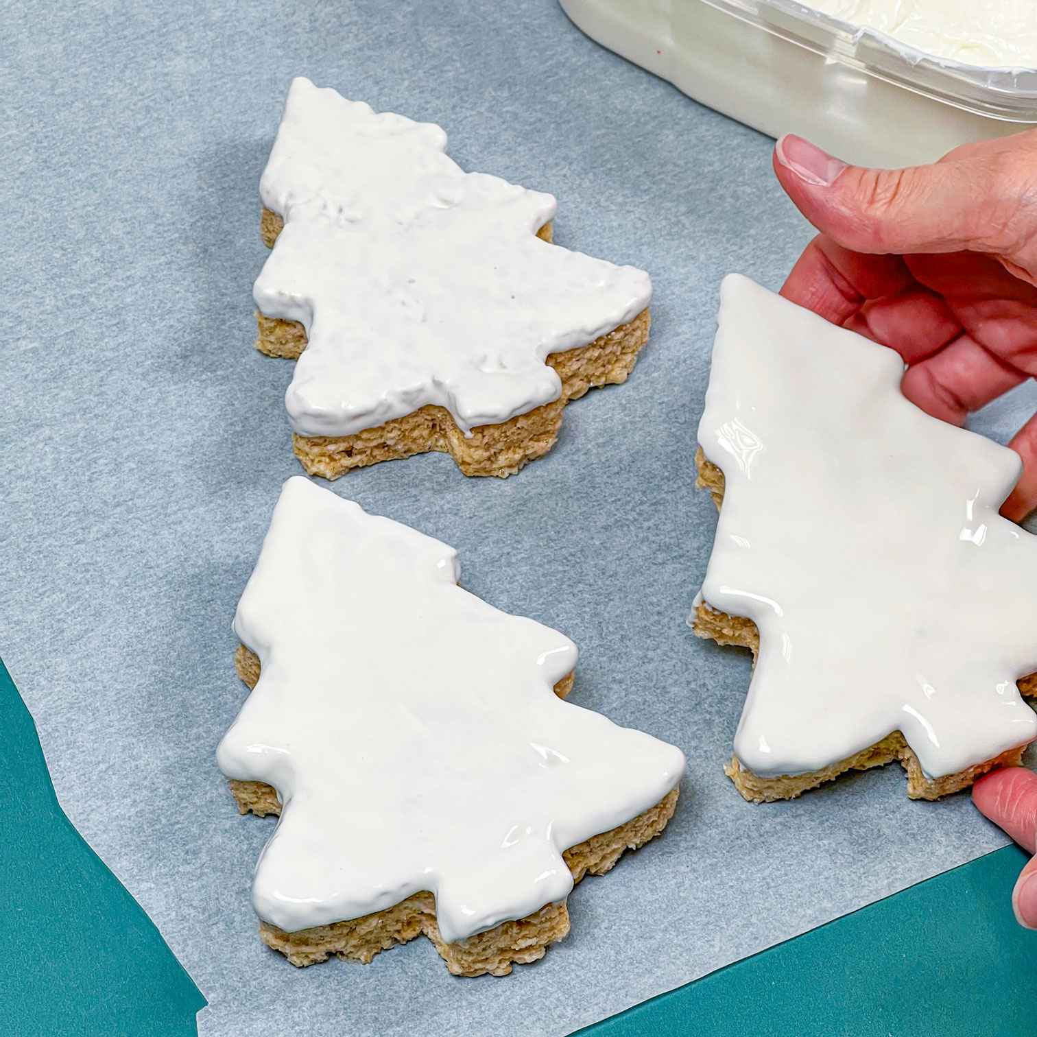 putting rice krispie treat onto parchment paper