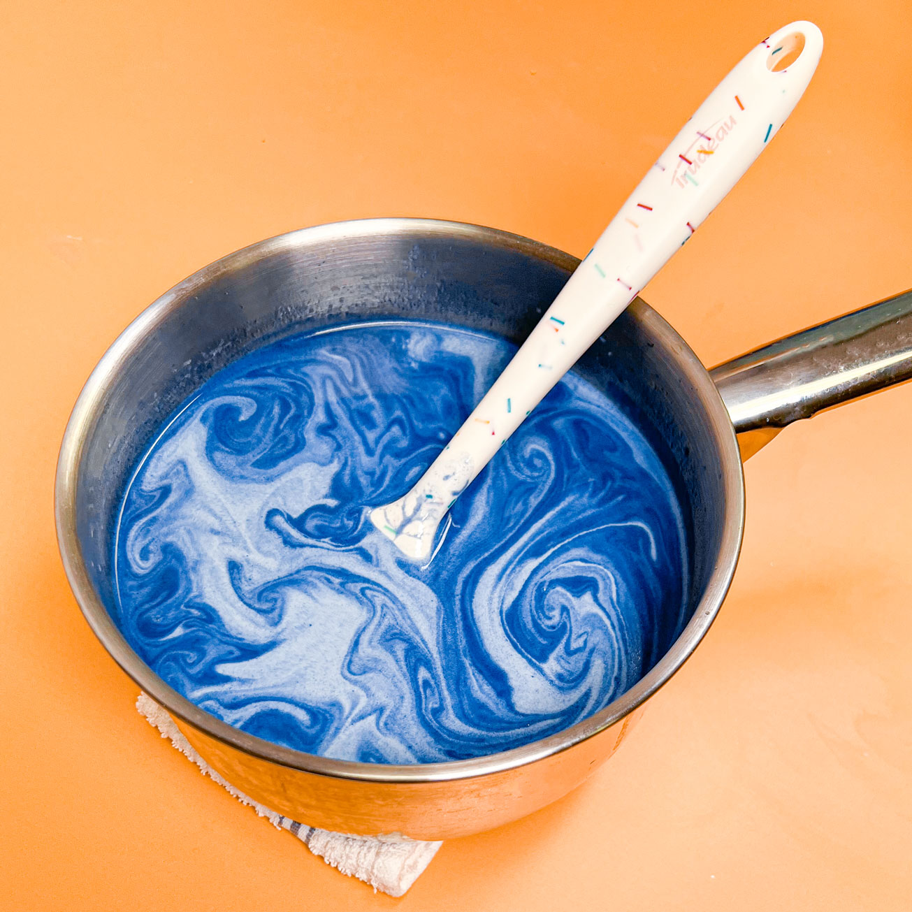 blue hot chocolate mixture in saucepan