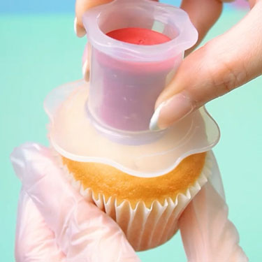 using cupcake corer to remove center of vanilla cupcake