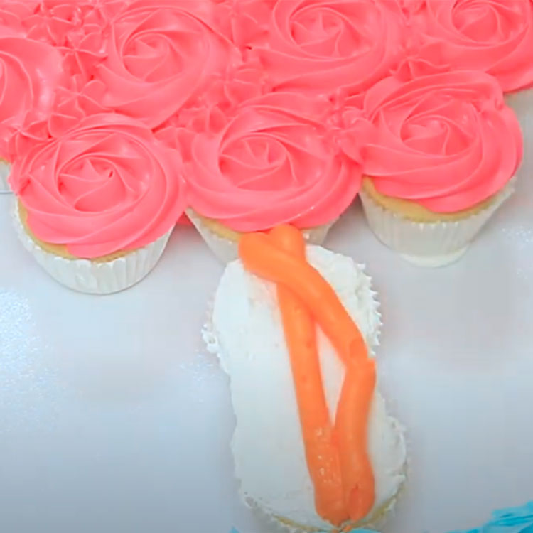 two piped lines made with orange buttercream