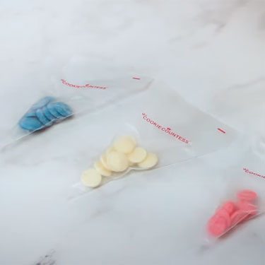 piping bags with colored candy melts for easy drizzling