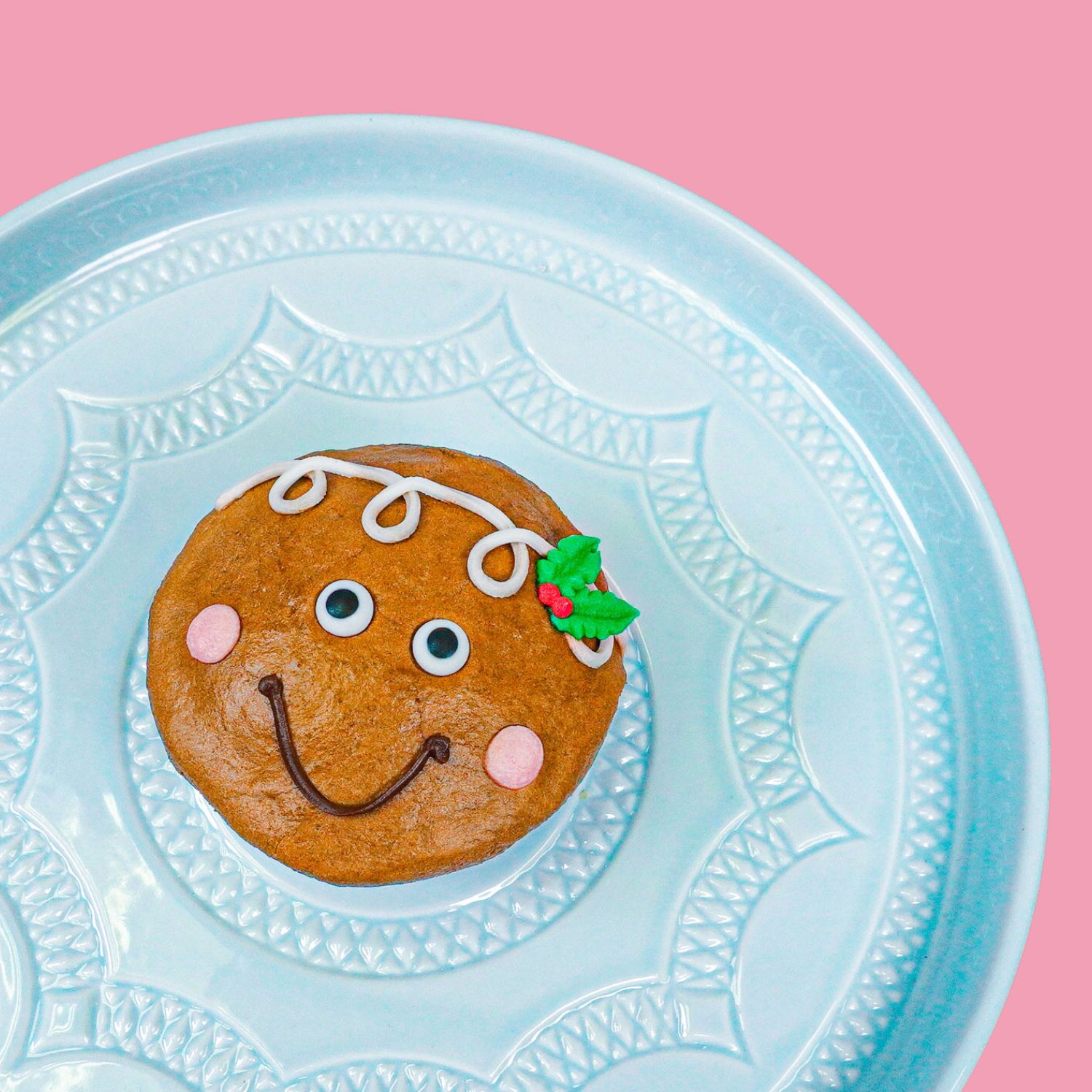 cupcake decorated to look like a gingerbread man
