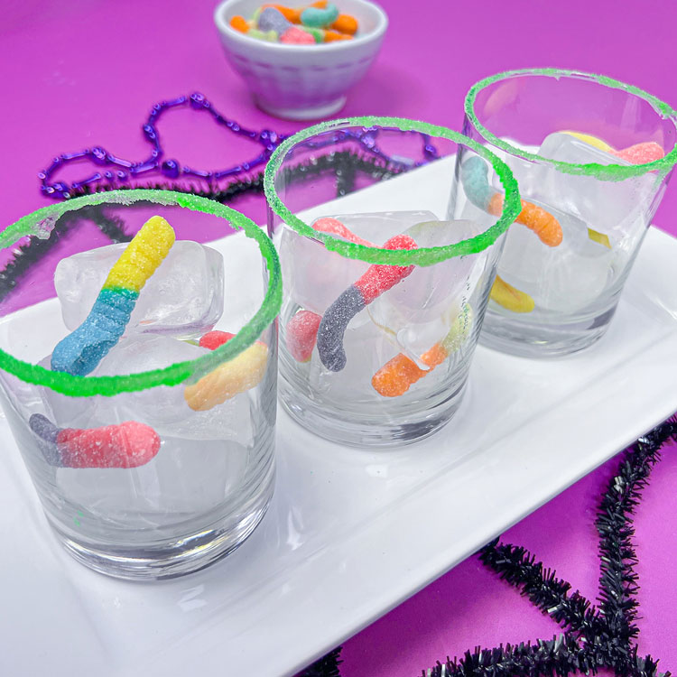 glasses filled with ice and sour gummy worms