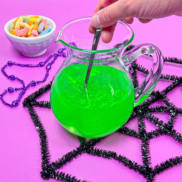 glass pitcher with neon green drink
