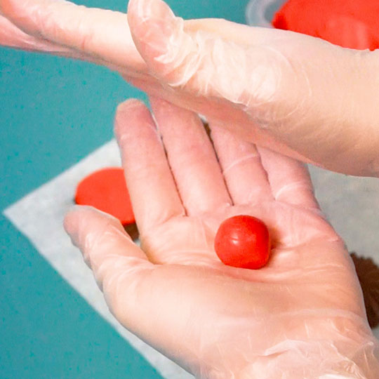rolling a ball of cherry candy center