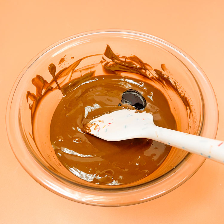 Bowl of Melted Chocolate with Black Oil-Based Color