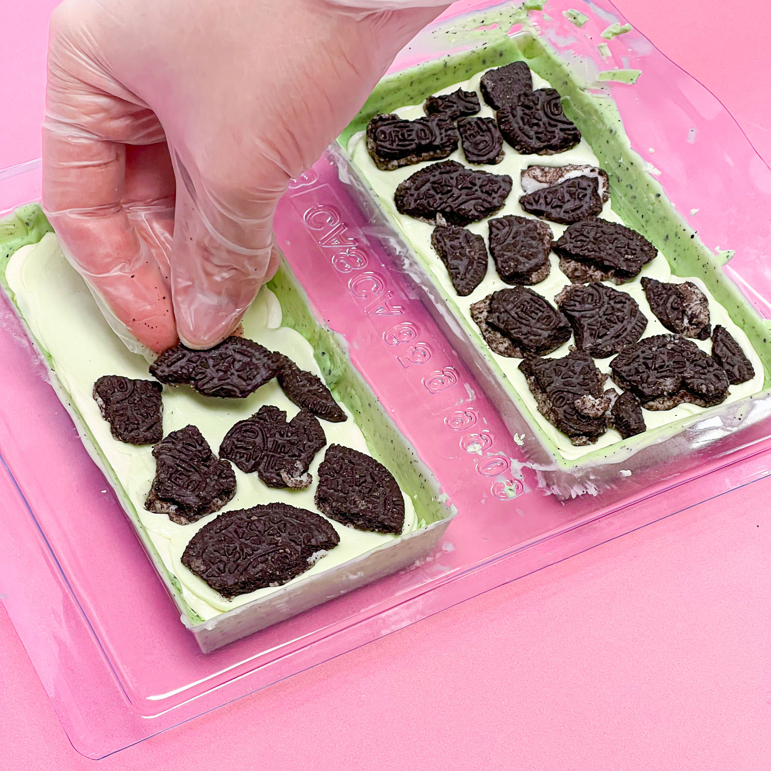 adding oreo pieces to candy bar