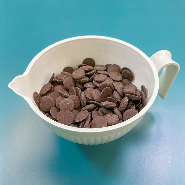 milk chocolate candy melts in white bowl