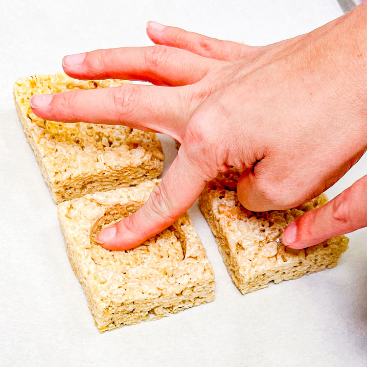 pressing rice krispie treat