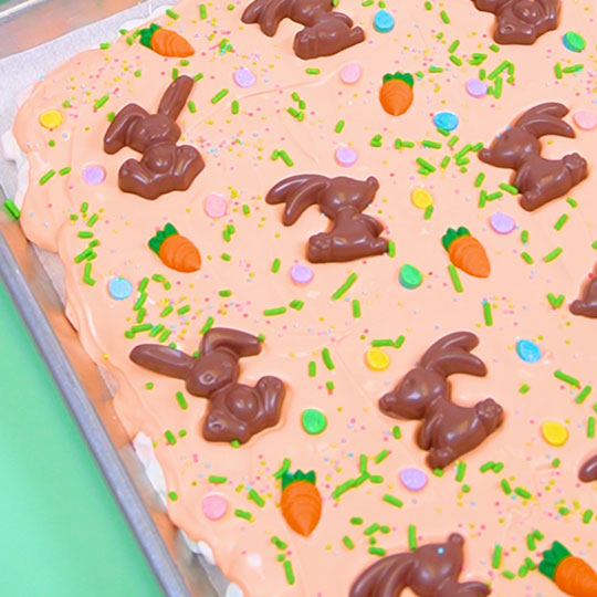 adding edible easter decorations to chocolate bark