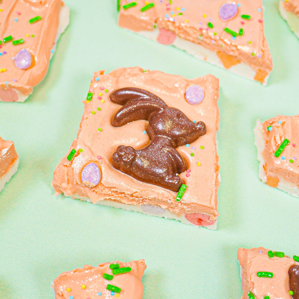 chocolate bunny on piece of orange chocolate bark