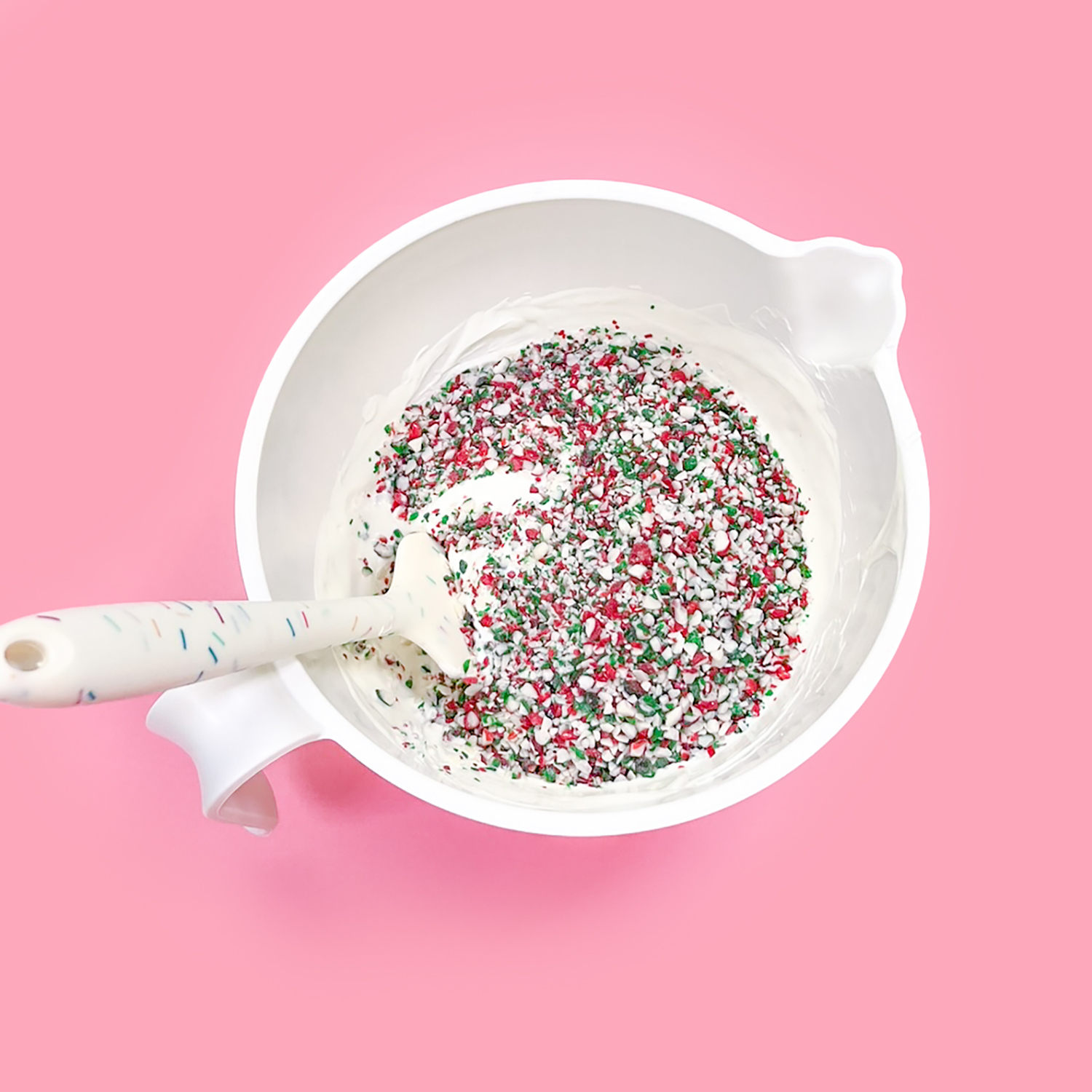 bowl of white candy melts with peppermint crunch