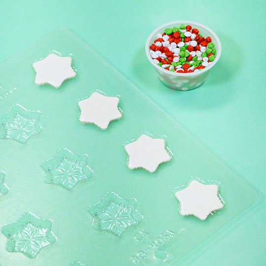 snowflake chocolate mold filled with white chocolate