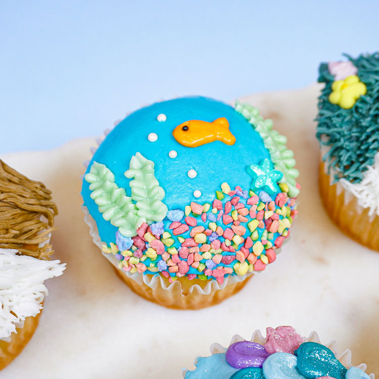 cupcake decorated to look like a fish bowl