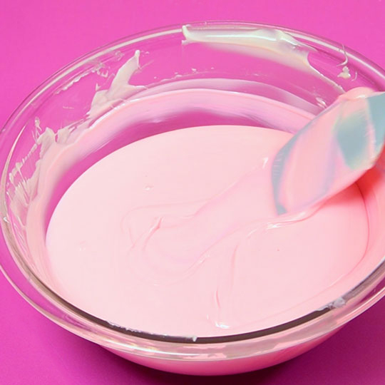 melted pink chocolate in a bowl