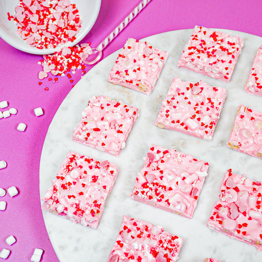 raspberry cheesecake chocolate bark on marble platter