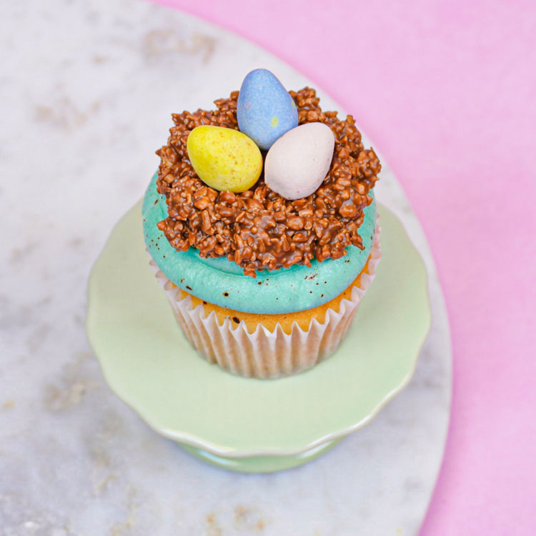 cupcake topped with a edible nest and Cadbury mini eggs