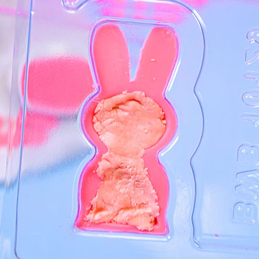 filling chocolate bunny shell with strawberry candy center