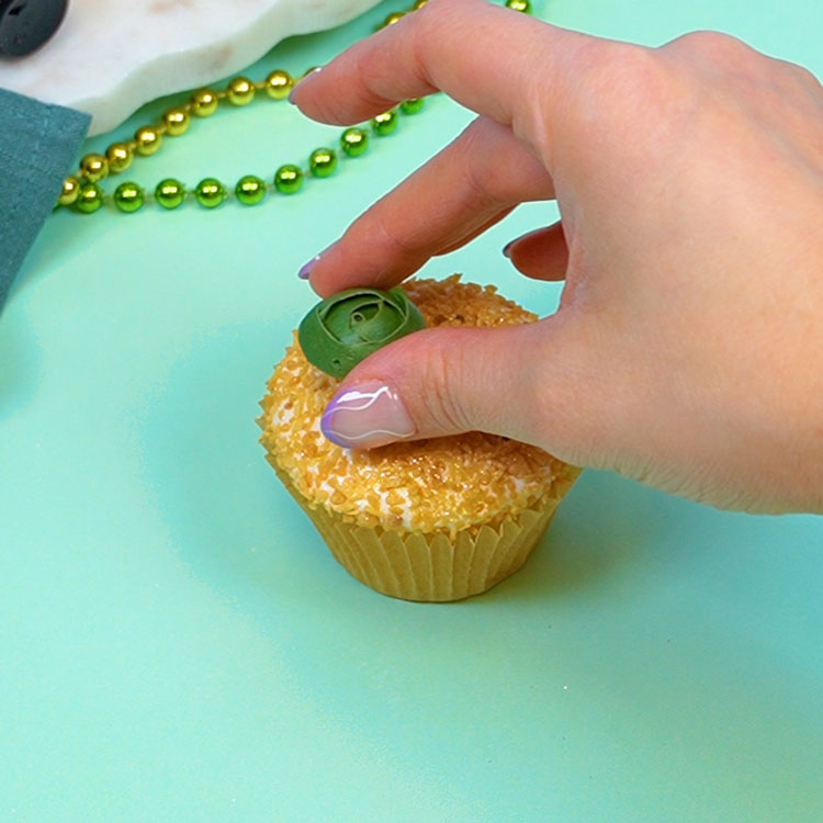 adding succulent transfer to cupcake