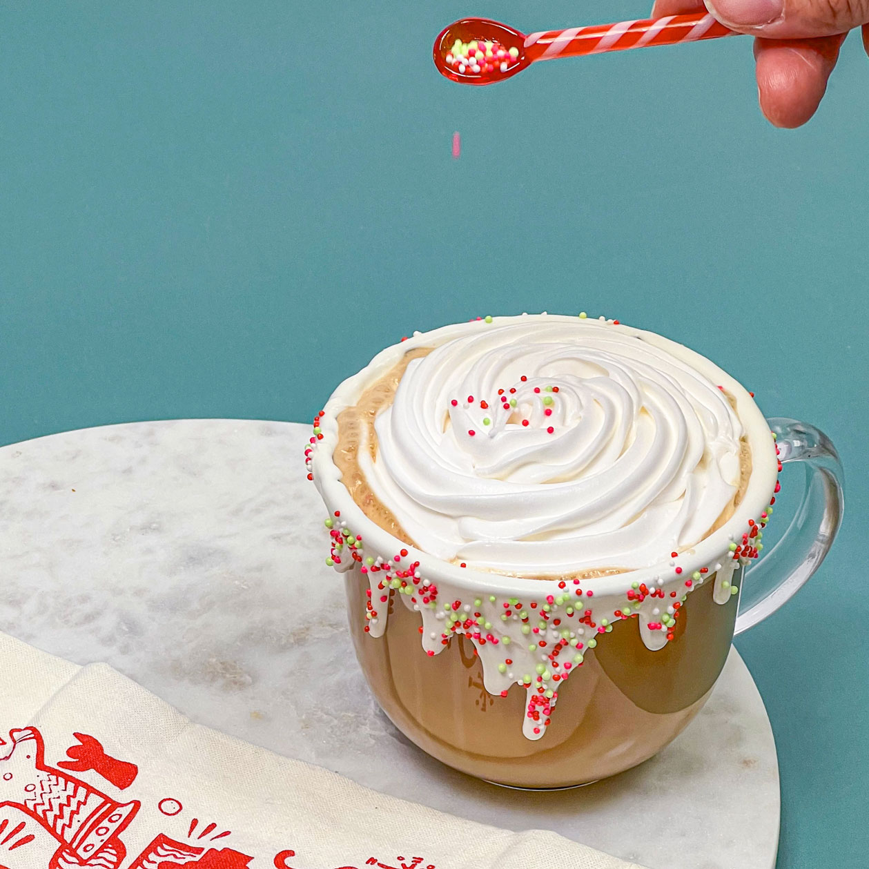 adding sprinkles on top of whipped cream