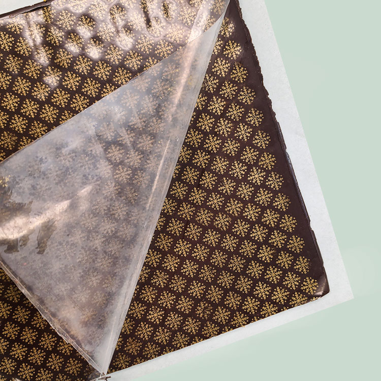 removing chocolate transfer sheet from chocolate bark