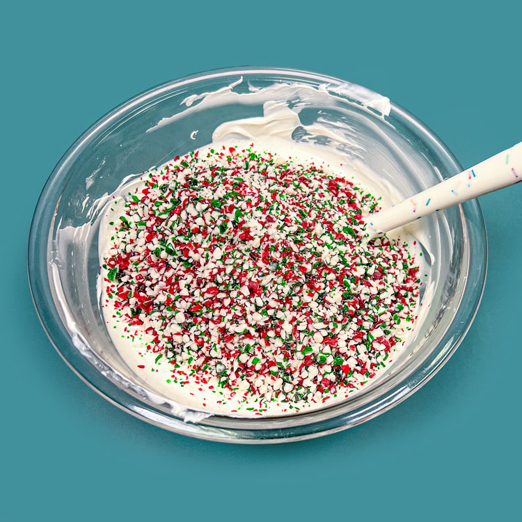 bowl of white candy melts and crushed peppermint candy
