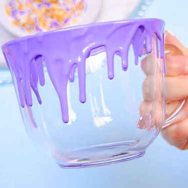 mug with purple chocolate drips going down the sides