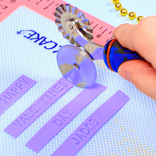 using a pastry wheel to trim fondant