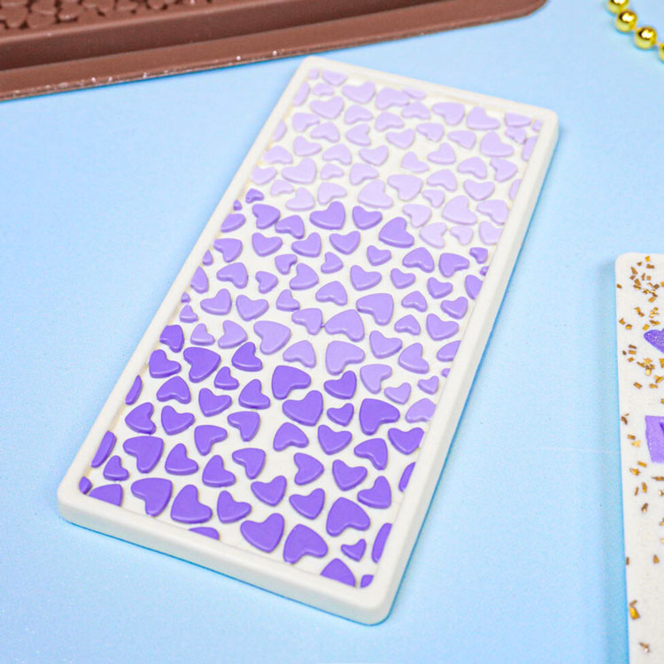 white chocolate bar with ombre purple hearts on top