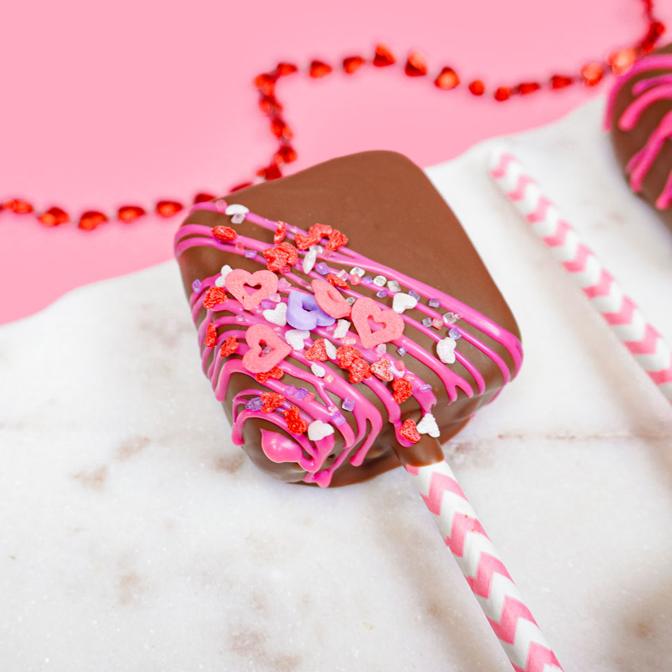 marshmallow pop decorated with valentine sprinkles 