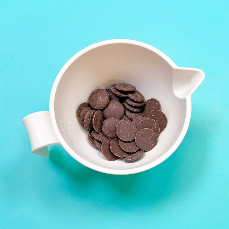 dark chocolate wafers in white bowl