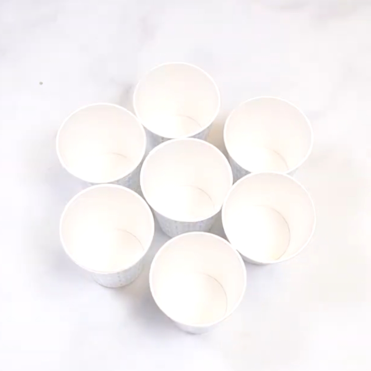 arranging paper cups for a cupcake bouquet
