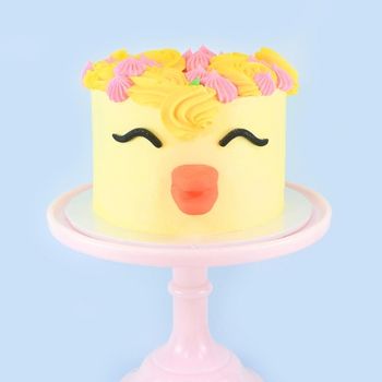 a cake decorated to look like and Easter chick